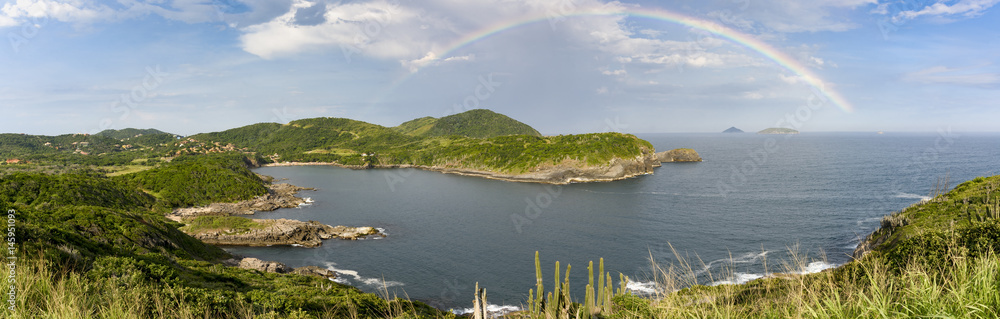Rainbow over the hill and beach in Buzios, north coast of Rio de Janeiro, Brazil