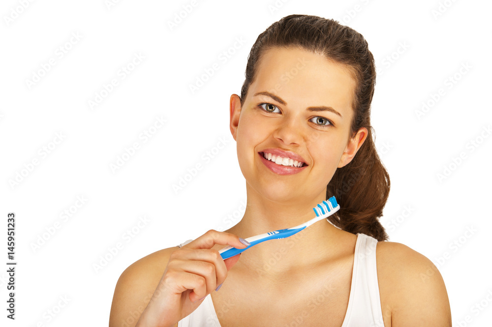 Young woman brushing teeth over white backgrund. Young woman brushing teeth over white backgrund.