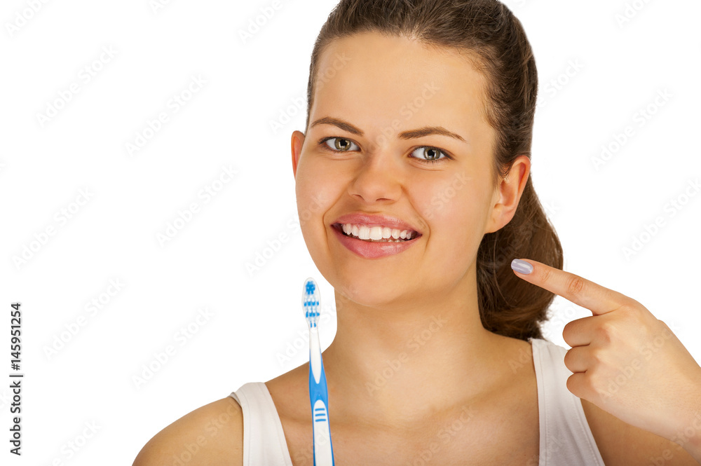 Woman poiting teeth with toothbrush over white background. Woman poiting teeth with toothbrush over white background.