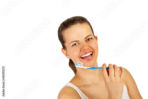 Young woman with teethbrush over white backgrund.