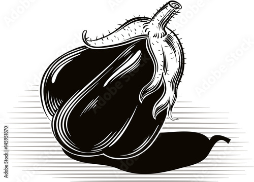 ripe aubergine, resting on a table.