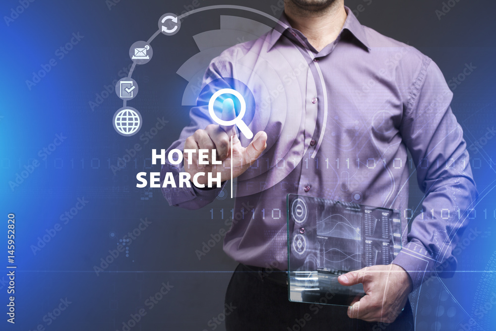 Business, Technology, Internet and network concept. Young businessman working on a virtual screen of the future and sees the inscription: Hotel search Business, Technology, Internet and network concept. Young businessman working on a virtual screen of the future and sees the inscription: Hotel search