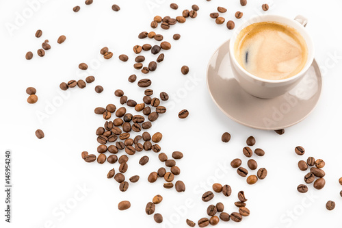coffee beans and cup of hot coffee isolated on white