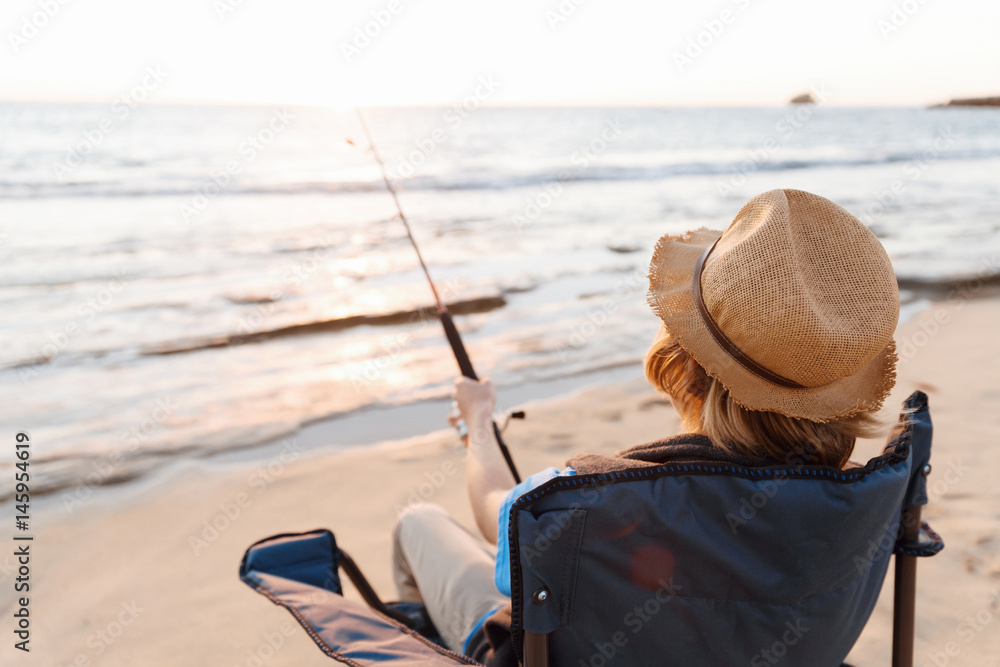 Teenage boy fishing at sea Teenage boy fishing at sea