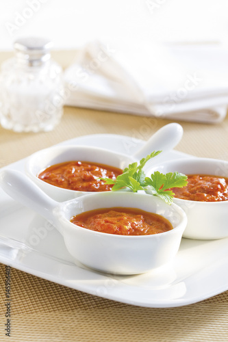 Three bowls of homemade tomato sauce.