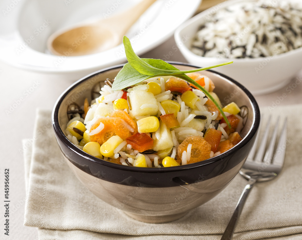 Delicious fresh rice salad with corn, tomato, melon and carrot. Delicious fresh rice salad with corn, tomato, melon and carrot.