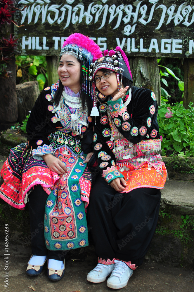 The tourists wear tribal costumes of Miao Tribal to enjoy for take photo, Thailand