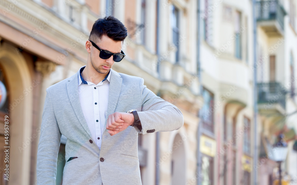 young business man watching time with surprised face on street young business man watching time with surprised face on street