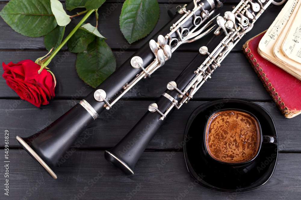 Musical background, poster - oboe, clarinet, rose, coffee, notes, symphony  orchestra. Top view. Musical still life. Stock Photo | Adobe Stock