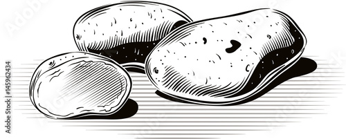 Potatoes resting on a plane.