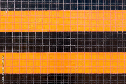 Colorful ceramic tiles mosaic - orange and black. Background