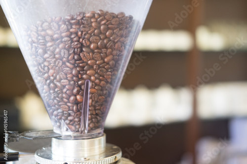 Roasted coffee beans in a grinder,