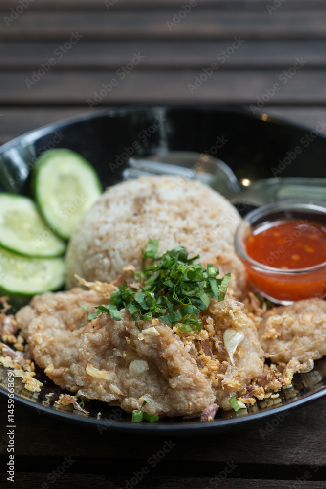 fried pork with fried rice and garlic