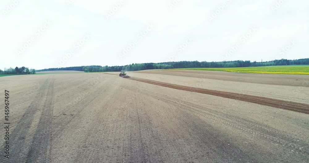 Tractor plowing field. Agriculture background. Tractor plowing field. Agriculture background.