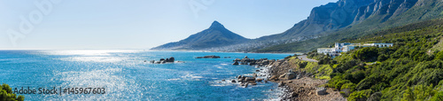 Panoramic view of the Camps Bay, Lion`s head peak and Twelve apostles mountain chain in Cape Town, South Africa photo
