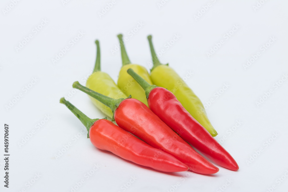 Close up green and red chili pepper on white background isolated.