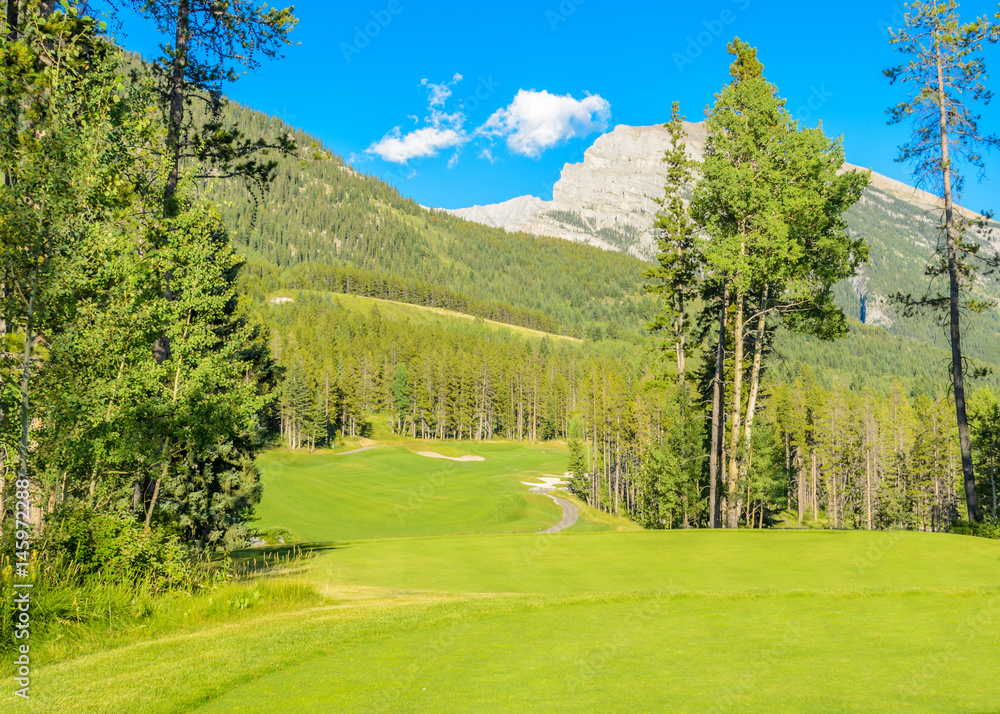 Golf course with gorgeous green over fantastic mountain view