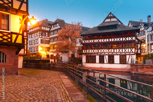 Traditional Alsatian half-timbered houses in Petite France during morning blue hour, Strasbourg, Alsace, France