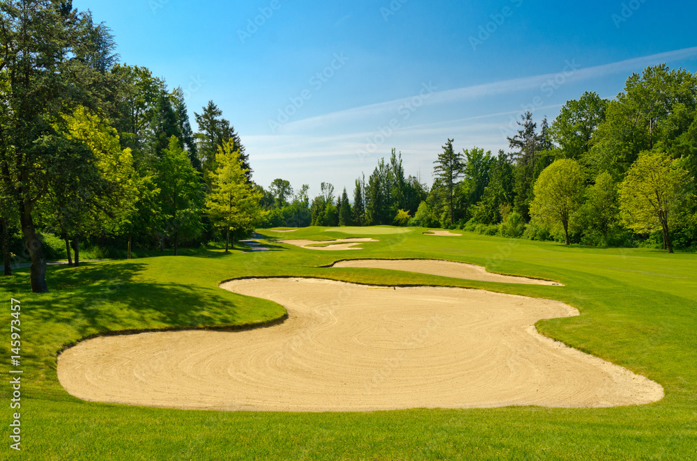 Golf course with gorgeous green and sand bunker Golf course with gorgeous green and sand bunker