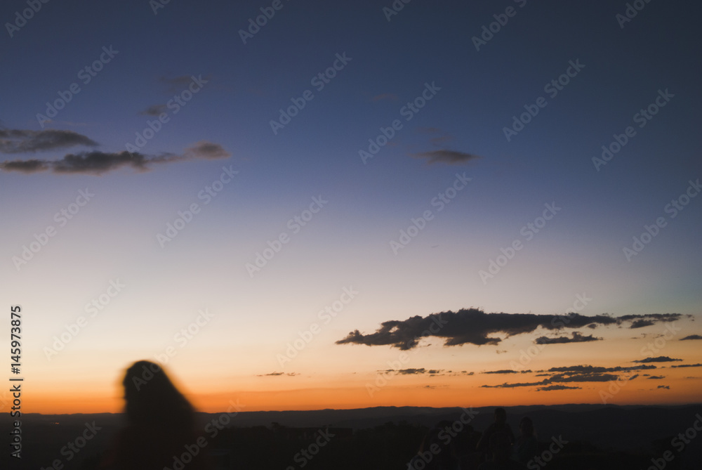 Girl silhouette at sunset in Brazil