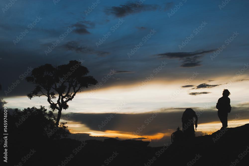 Men silhouette at sunset in Brazil