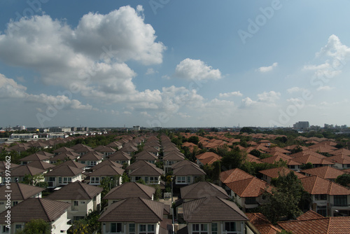 bird eye view rooftop of habitat for humanity under blue sky and cloud