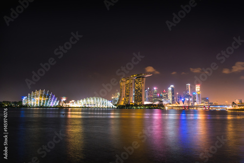 Night sky at Singapore Skyline and skyscrapers on Marina Bay.