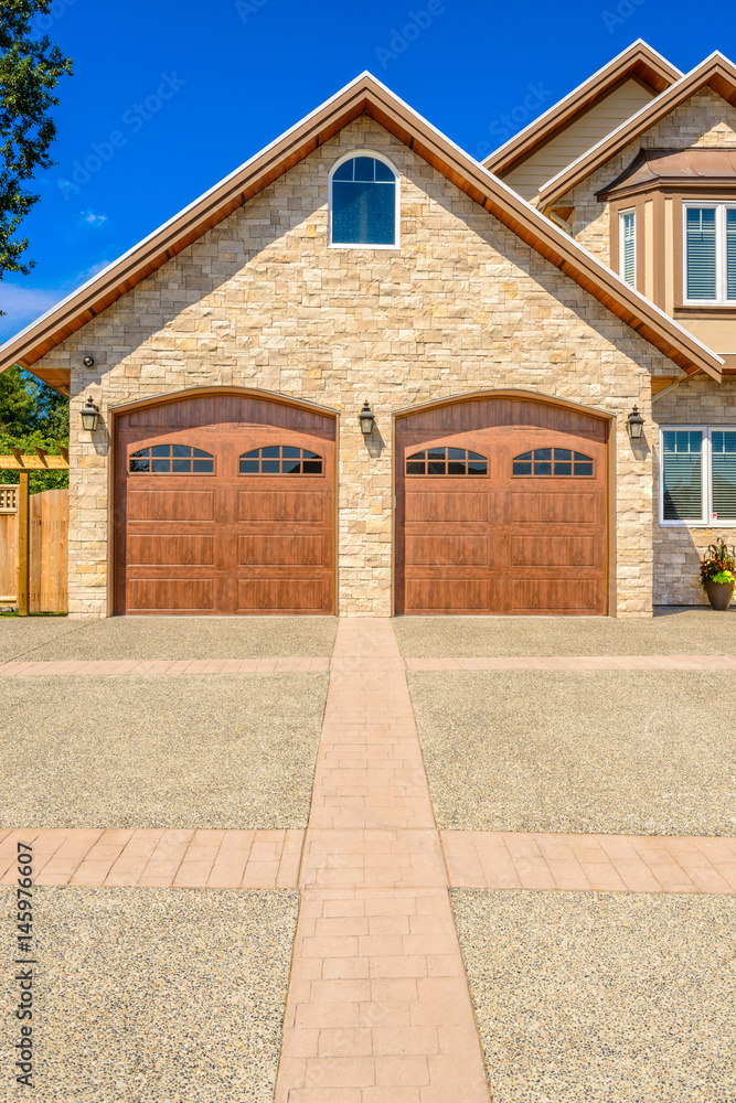 Fototapeta premium Fragment of a luxury house with a garage door in Vancouver, Canada.