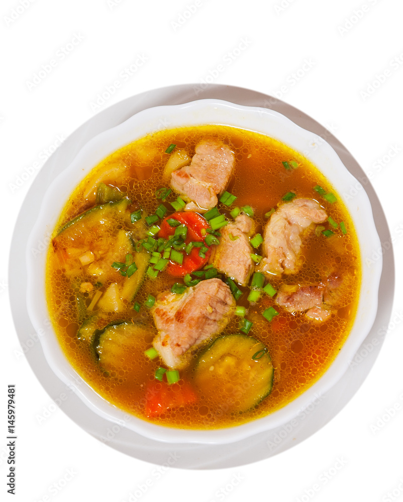 Meat soup with vegetables. top view. isolated on white