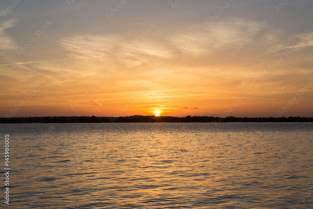 Sunset in lake at Martin Dies state park, Texas