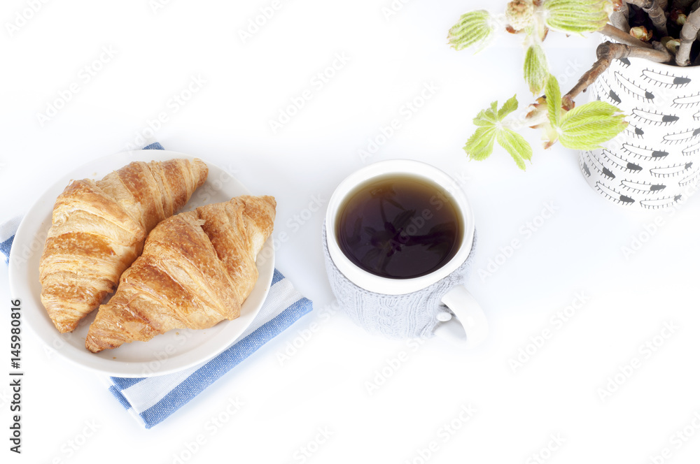 Beautiful set of cup of tea and croissants and spring buds on a white background. Beautiful set of cup of tea and croissants and spring buds on a white background.
