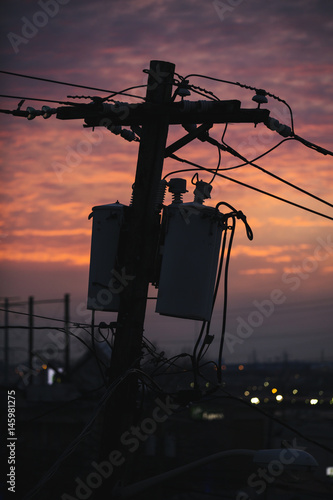 Transformer electric pole at sunset.
