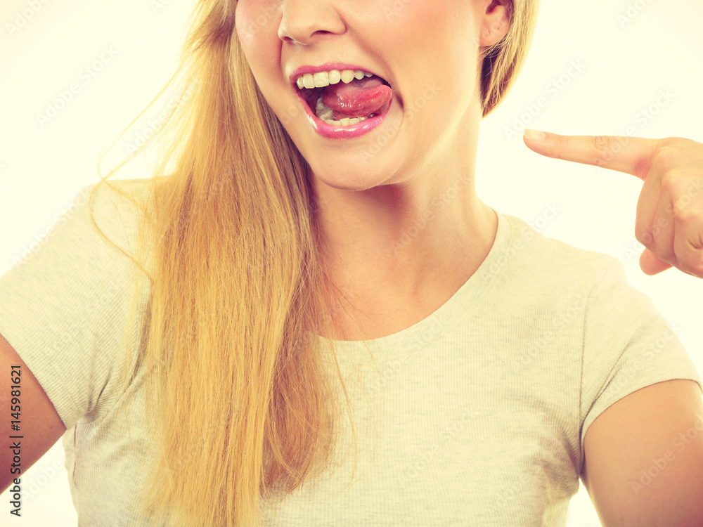 Funny blonde woman sitcking tongue out Funny blonde woman sitcking tongue out