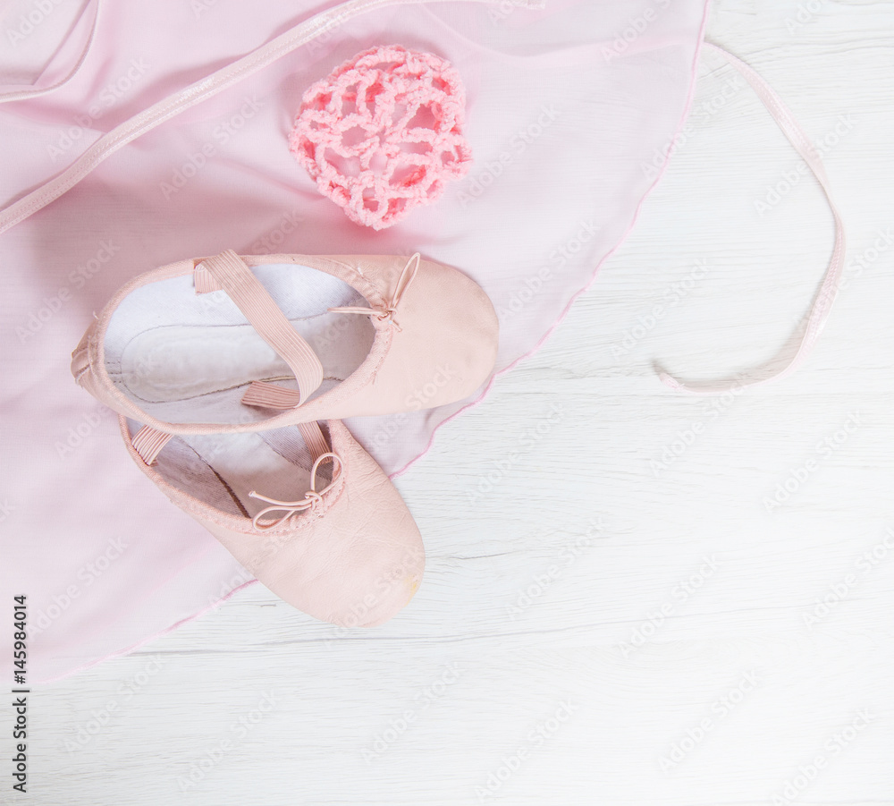Pair of two satin pink ballet shoes and tutu Pair of two satin pink ballet shoes and tutu
