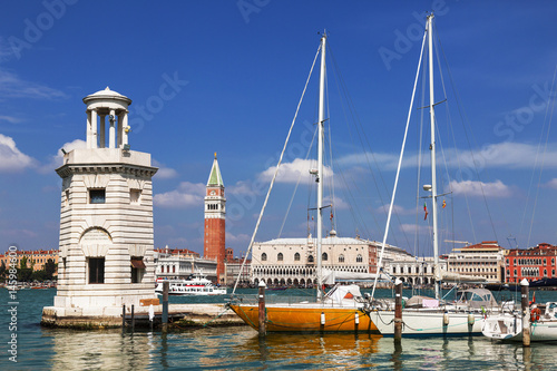 View of the Piazza San Marco, the lighthouse at the island of San Giorgio Maggiore and yachts at berth. Venice. Italy