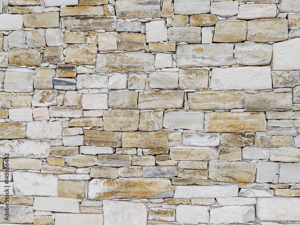 Fototapeta premium Architectural stone facing as a background image.