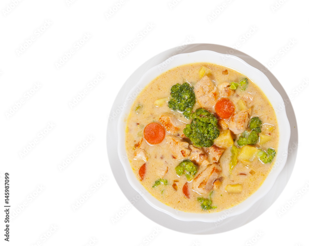  chicken soup with vegetables and cheese. top view. isolated on white