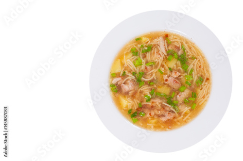  chicken soup with noodle and vegetables. top view. isolated on white