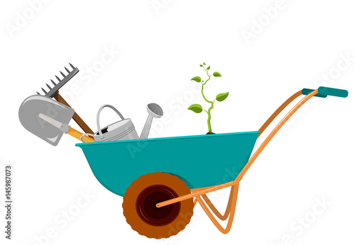 Fototapeta wheelbarrow with a shovel, a rake, a watering can and a sprout.