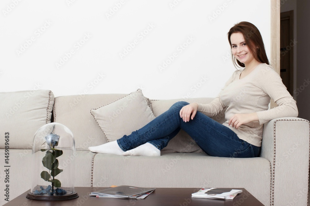 Beautiful young woman watching television Beautiful young woman watching television