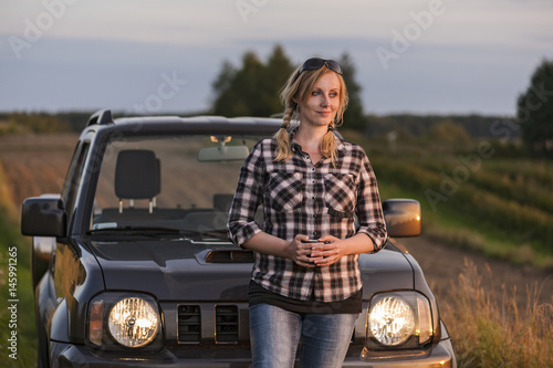 Young woman enjoying off road trip photo