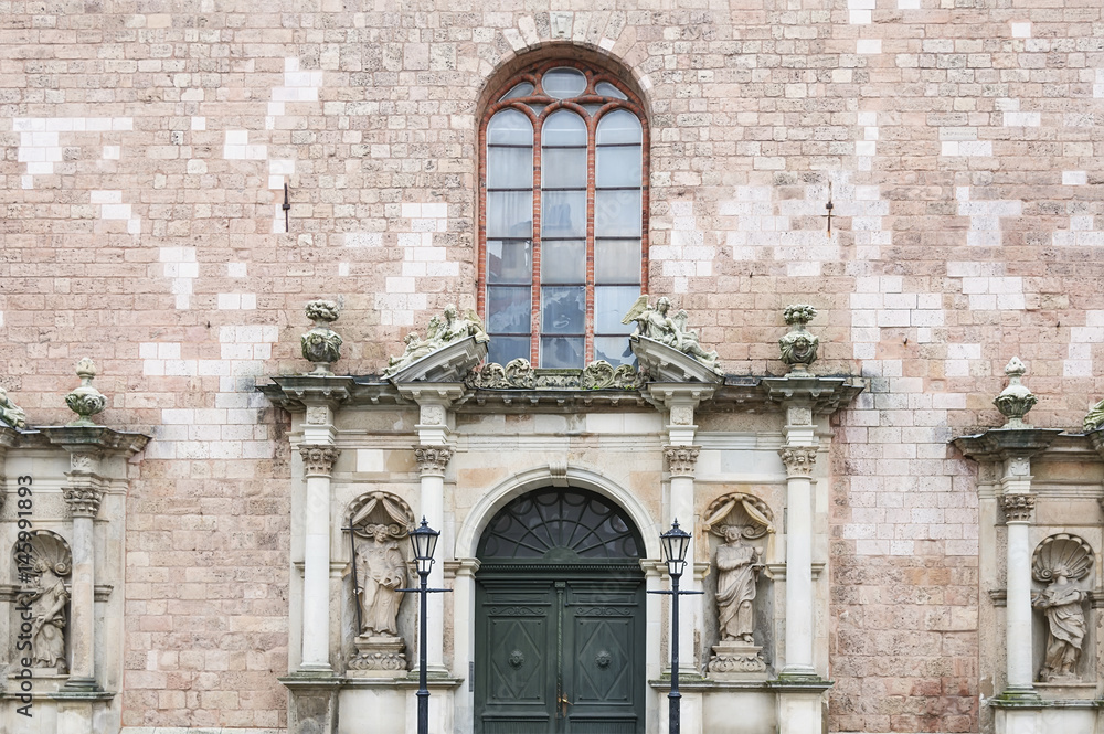 Church wall with door and window in Riga