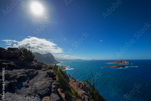 View of Oahu's south shore towards Makapuu Beach from a ocean side cliff trail photo