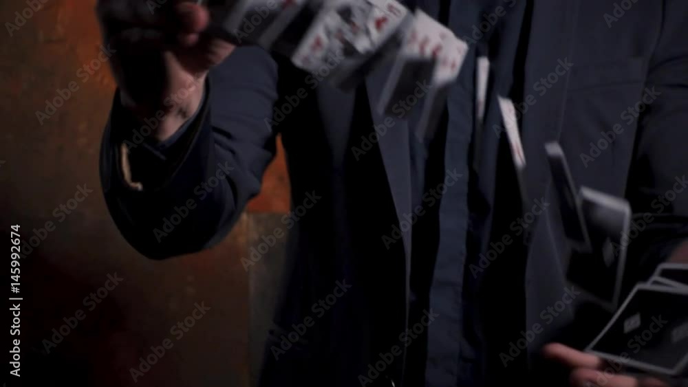 Young man showing card tricks Young man showing card tricks