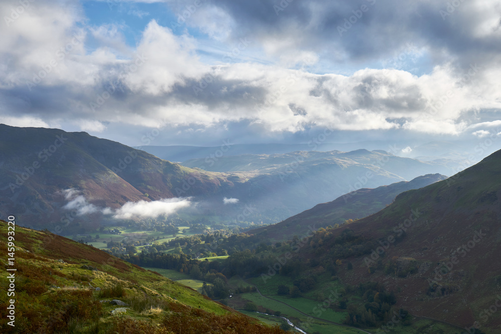 Fototapeta premium Looking down the trail towards Patterdale and Glenridding that leads up to the Hole in the Wall below Helvellyn in the Lake District, England, UK.