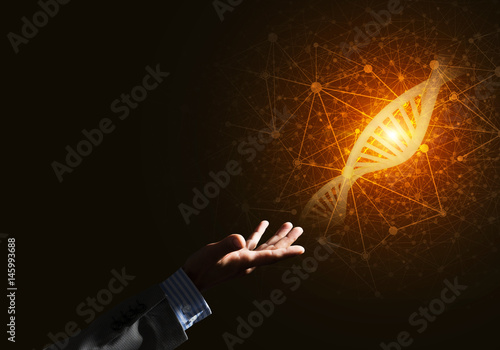 Science medicine and technology concepts as DNA molecule on dark background with connection lines © adam121