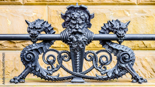 Neptune and Serpents wrought iron fence photo