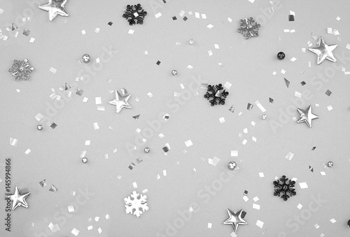Black & white confetti on a gray background. Monochrome concept of holydays.