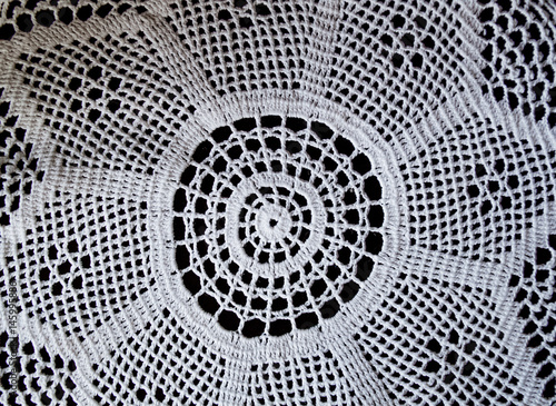 Handmade, white crochet, embroidery, on a black background, contrast