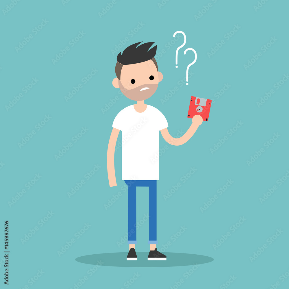 Outdated technology concept. Young bearded man has no idea what to do with the floppy disk / flat editable vector illustration Outdated technology concept. Young bearded man has no idea what to do with the floppy disk / flat editable vector illustration